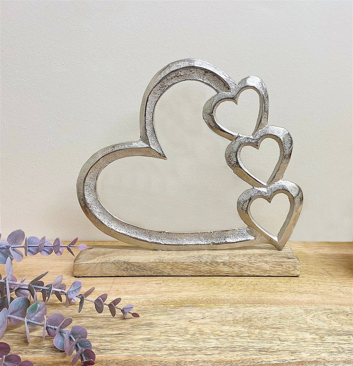 Metal Silver Four Heart Ornament On A Wooden Base Large